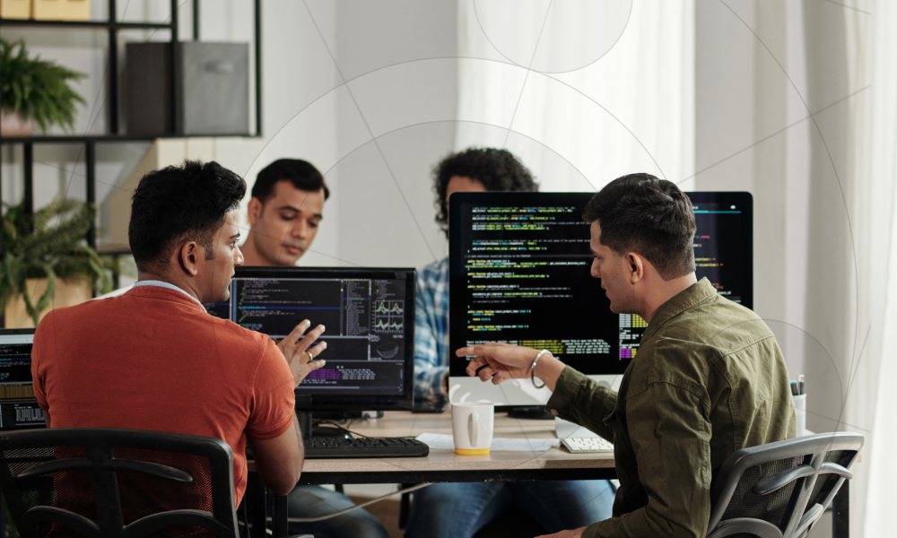 Offshore development team collaborating on source code modifications and technical software solutions during an agile sprint review.